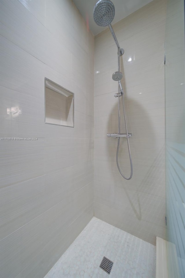 bathroom with tiled shower