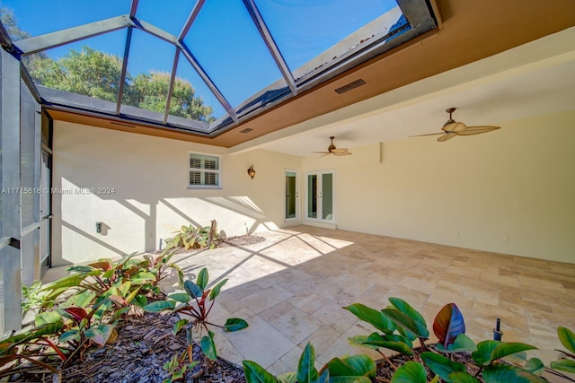 exterior space with a lanai, french doors, and a patio