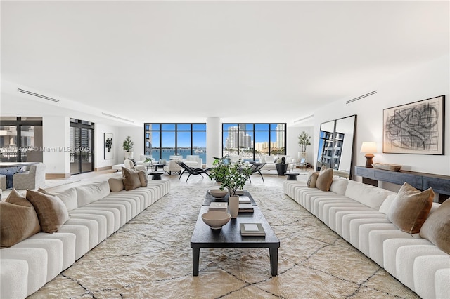 living room with floor to ceiling windows