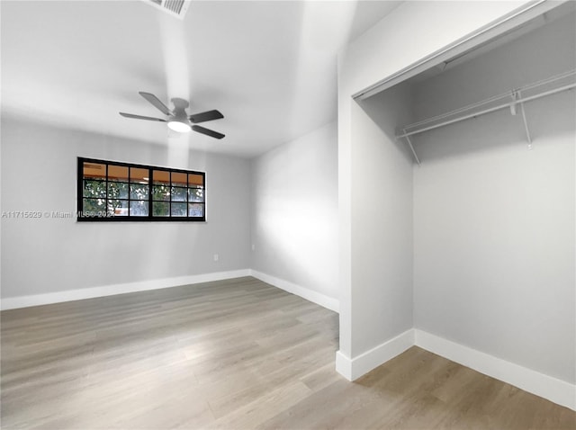 spare room featuring ceiling fan and light hardwood / wood-style floors