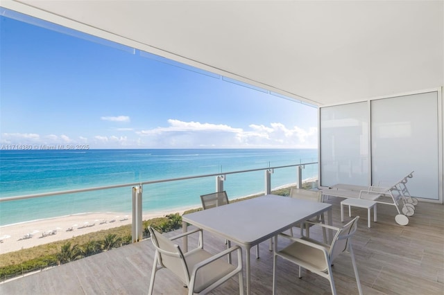 balcony with a view of the beach and a water view