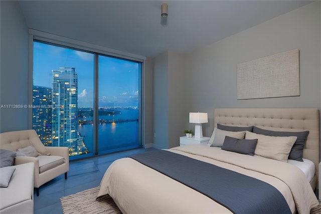 bedroom with access to outside, floor to ceiling windows, and tile patterned flooring