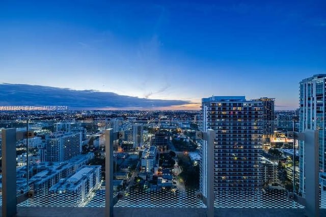 property's view of city featuring a mountain view