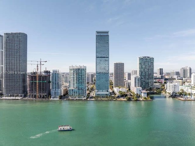 property's view of city featuring a water view