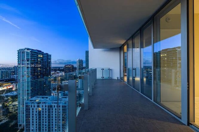 view of balcony at dusk