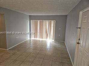 view of tiled spare room