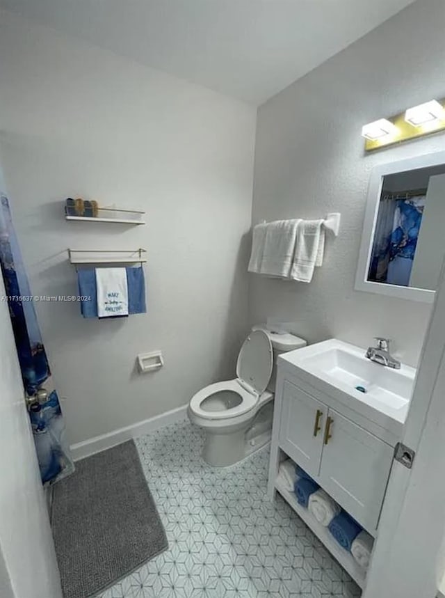 bathroom with vanity and toilet