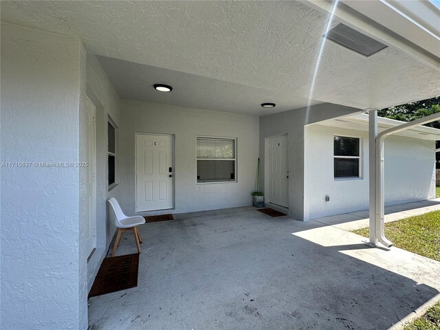 doorway to property with a patio