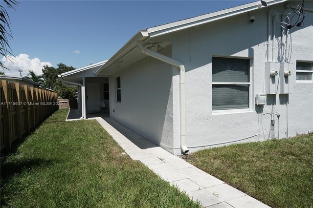 view of home's exterior featuring a lawn