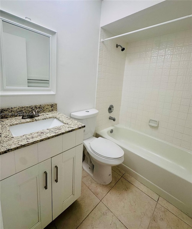 full bathroom featuring tile patterned floors, vanity, toilet, and tiled shower / bath