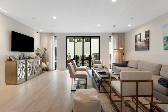 living room with light hardwood / wood-style flooring