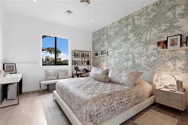 bedroom featuring hardwood / wood-style flooring and ceiling fan