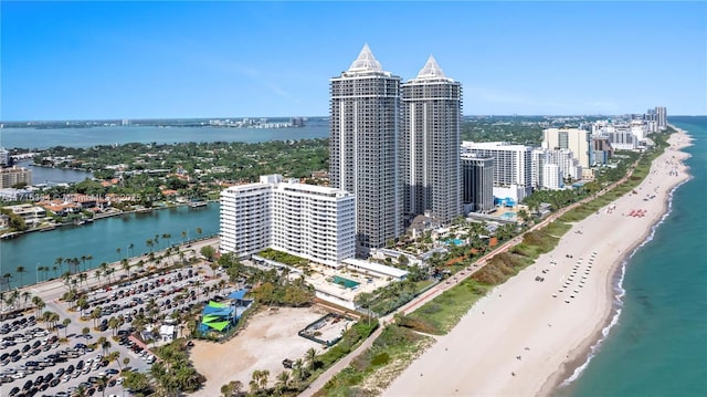 aerial view with a water view and a view of the beach