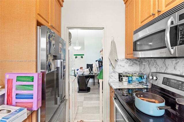 kitchen with decorative backsplash and stainless steel appliances