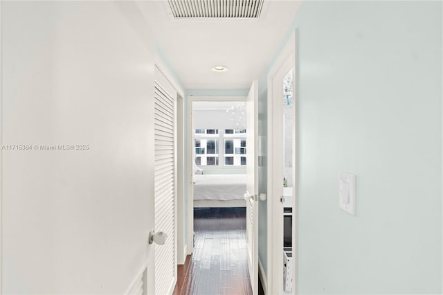 hall featuring dark wood-type flooring