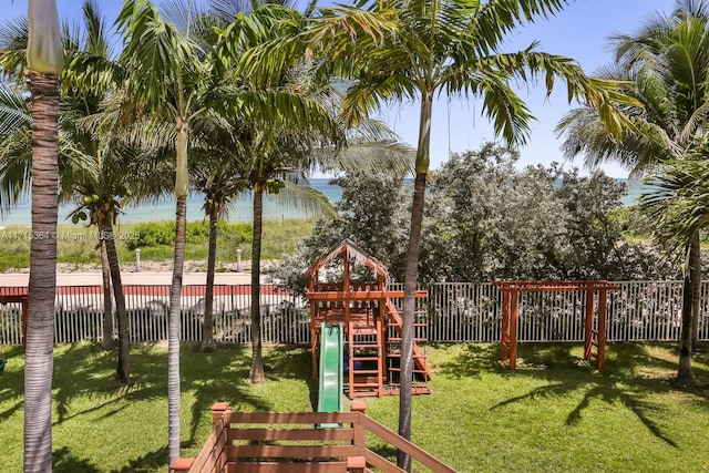 view of playground featuring a water view and a yard