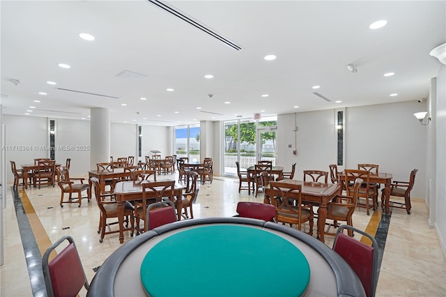 dining room with floor to ceiling windows