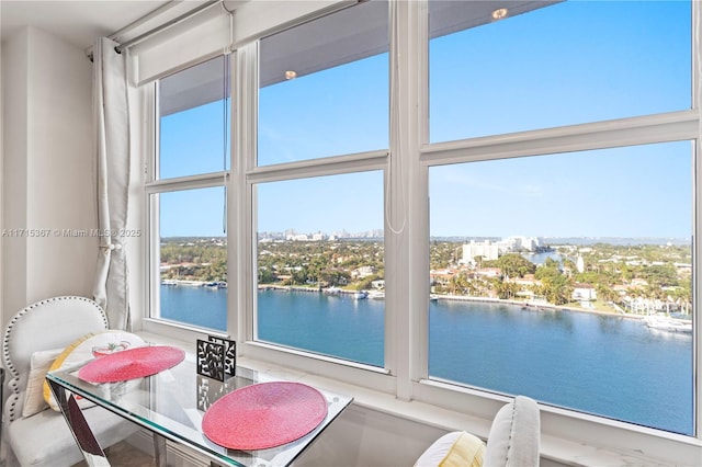 sunroom / solarium with a water view