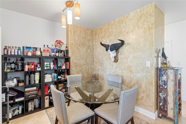 dining space with tile patterned flooring