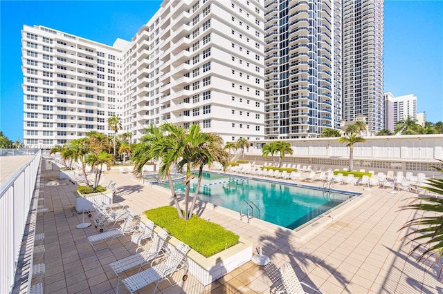 view of swimming pool with a patio area