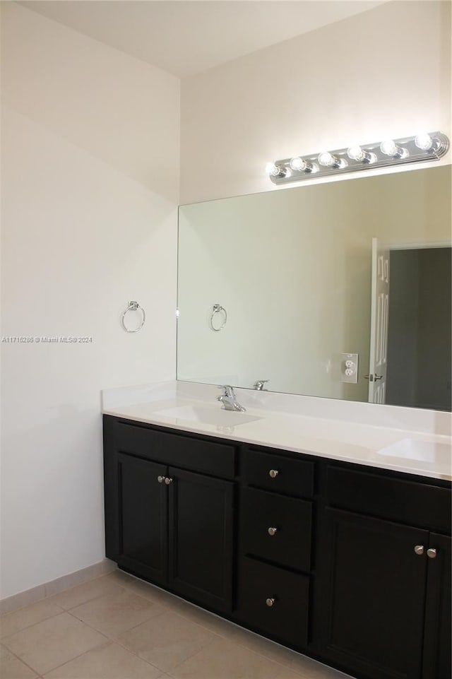 bathroom with tile patterned flooring and vanity