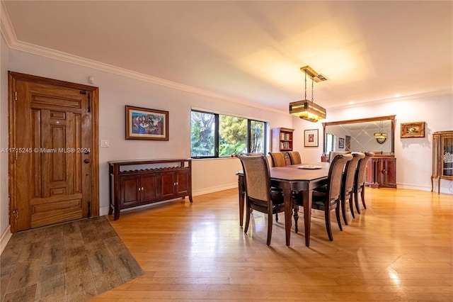 3111 N 52nd Ave, Hollywood, FL 33021 - dining space with crown molding and light wood-style flooring