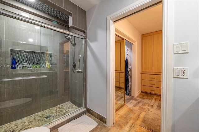 3111 N 52nd Ave, Hollywood, FL 33021 - bathroom featuring wood finished floors and a shower stall