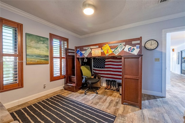 office with crown molding, hardwood / wood-style floors, and a textured ceiling