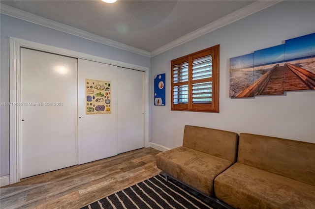 interior space featuring crown molding and hardwood / wood-style floors