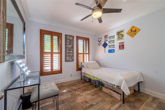 bedroom with hardwood / wood-style floors, ceiling fan, and ornamental molding