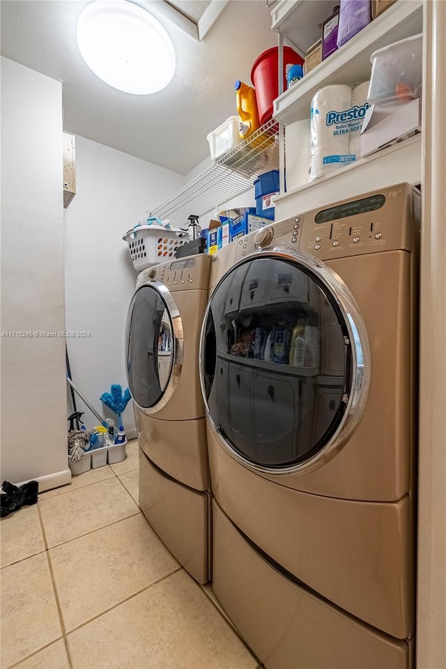 washroom featuring tile patterned floors and separate washer and dryer