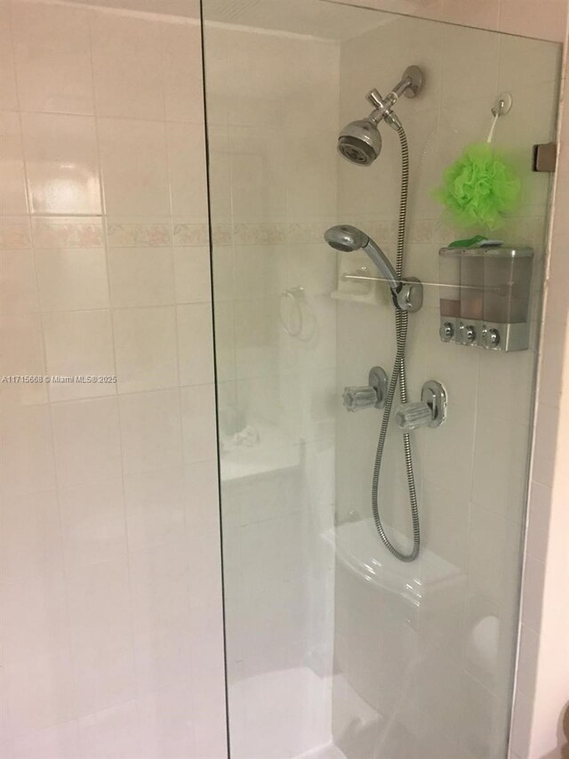 bathroom with tiled shower