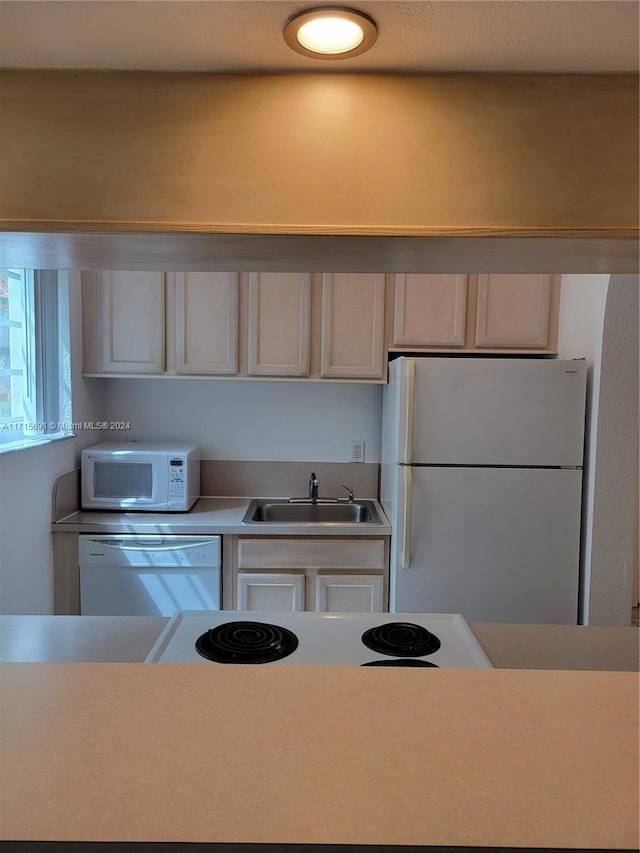 kitchen with white appliances and sink