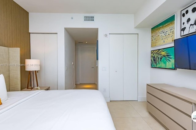 bedroom with light tile patterned floors