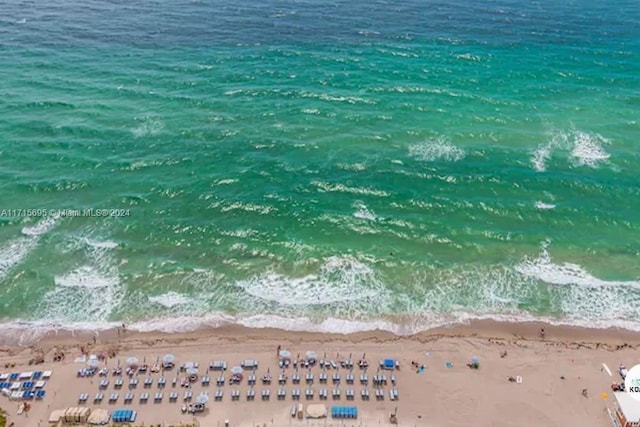 aerial view with a view of the beach and a water view