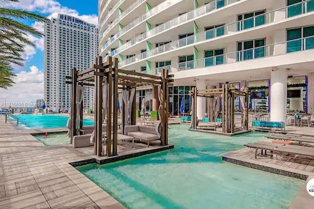 view of pool with a patio area and a pergola