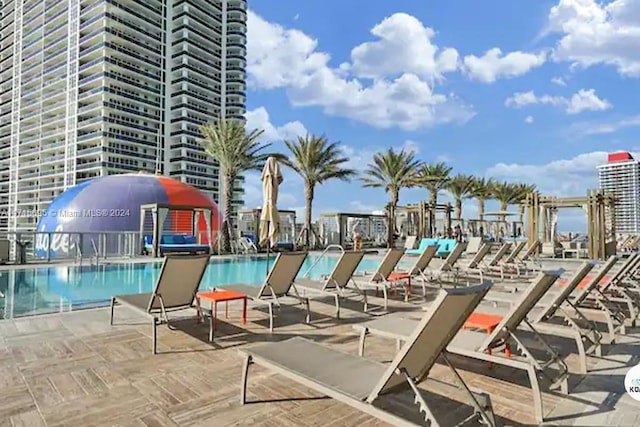 view of swimming pool with a patio area