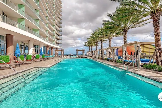 view of swimming pool with a patio area