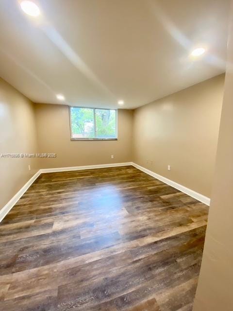 empty room featuring dark hardwood / wood-style floors