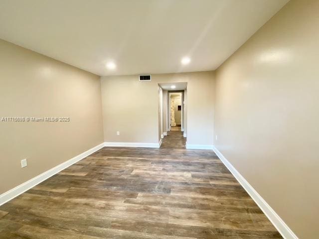 empty room featuring dark hardwood / wood-style floors