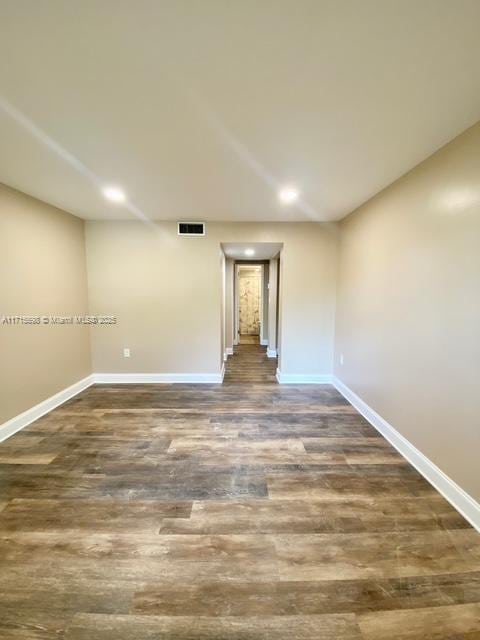 empty room featuring dark hardwood / wood-style floors