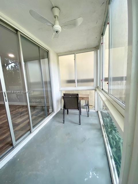 sunroom / solarium featuring ceiling fan