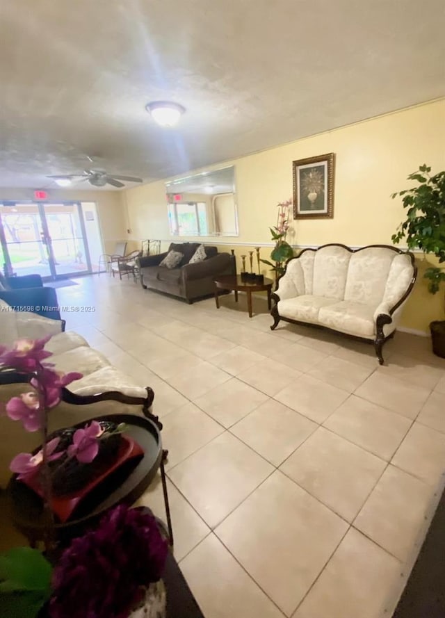 living room with light tile patterned flooring and ceiling fan