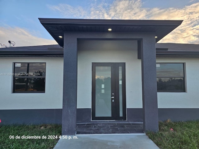 2513 62nd St W, Lehigh Acres, FL 33971 - view of exterior entry at dusk