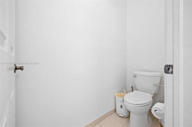 bathroom with tile patterned floors and toilet