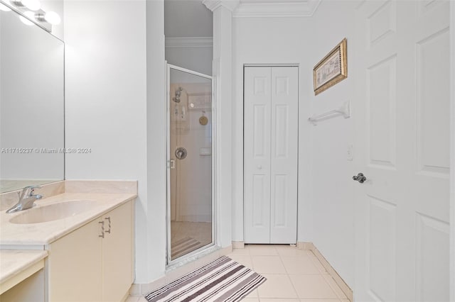 bathroom with vanity, tile patterned floors, walk in shower, and ornamental molding