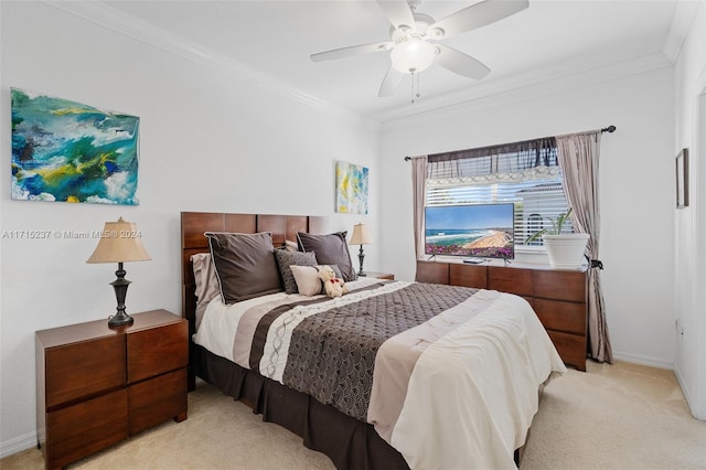 bedroom with light carpet, ceiling fan, and crown molding