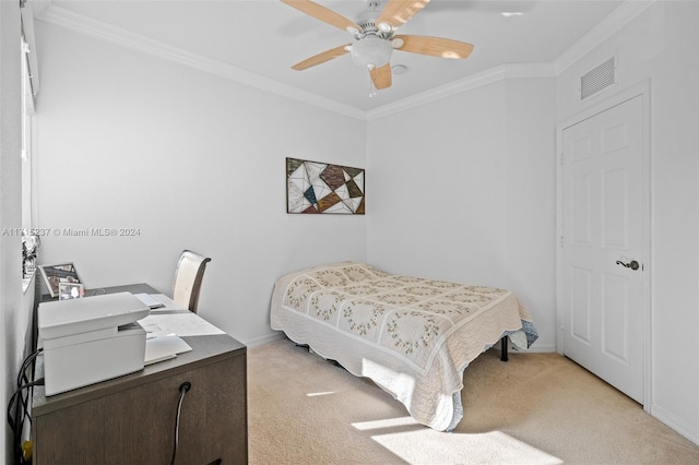 bedroom featuring ceiling fan, light colored carpet, and ornamental molding