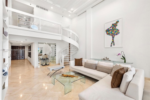 living room featuring a high ceiling