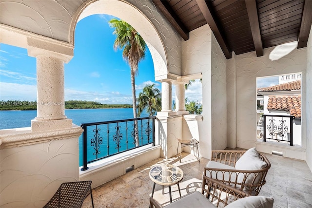 balcony featuring a water view